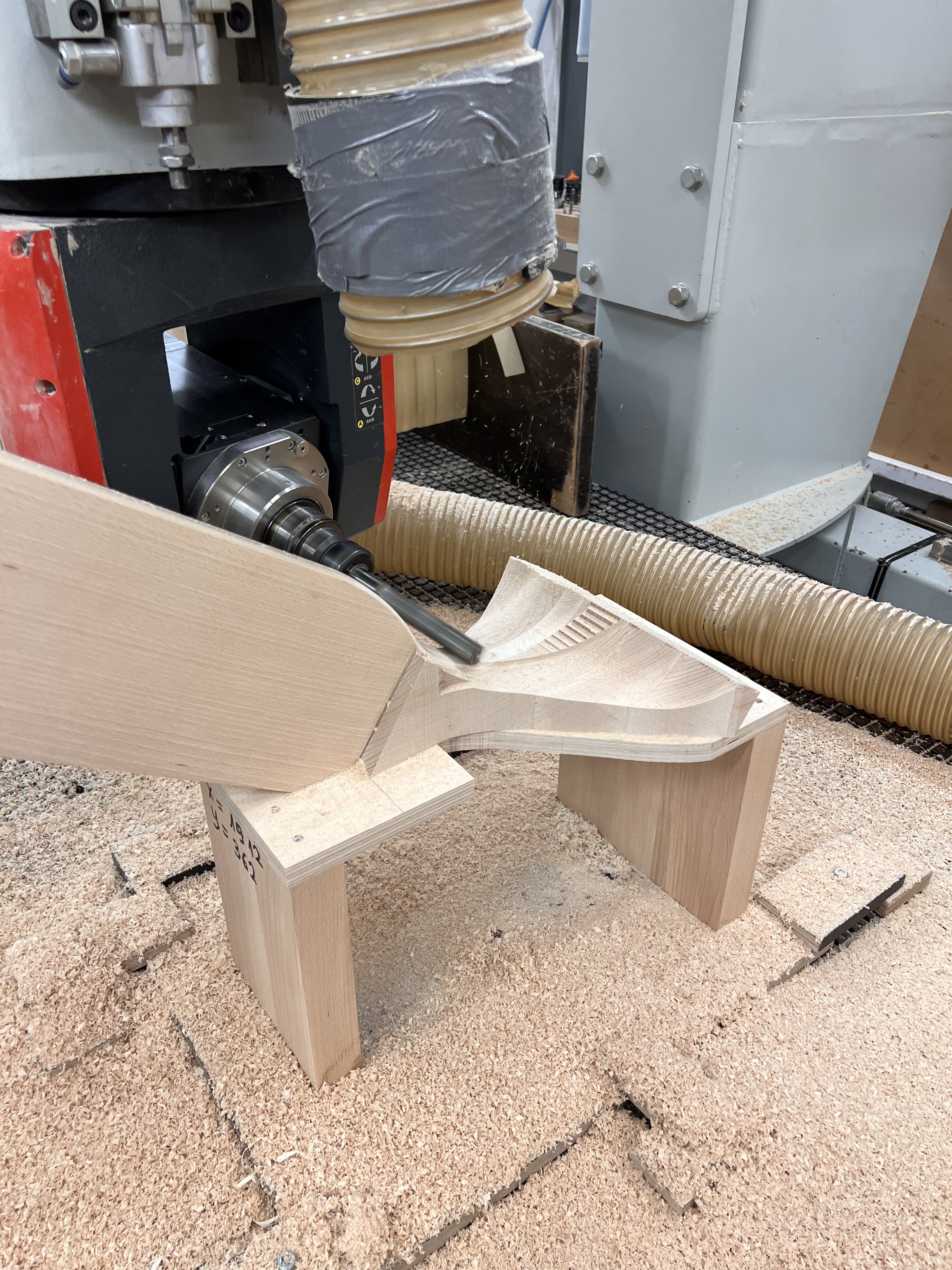 CNC milling machine shaping a wooden furniture leg at Styrczula factory